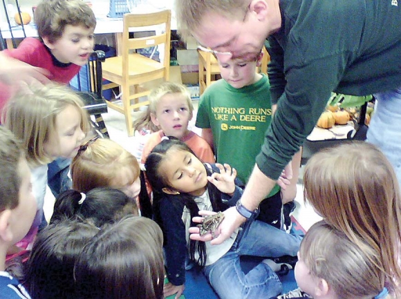 Elementary school students get an up-close look during a Highlands Nature Center outreach program. Donated photo