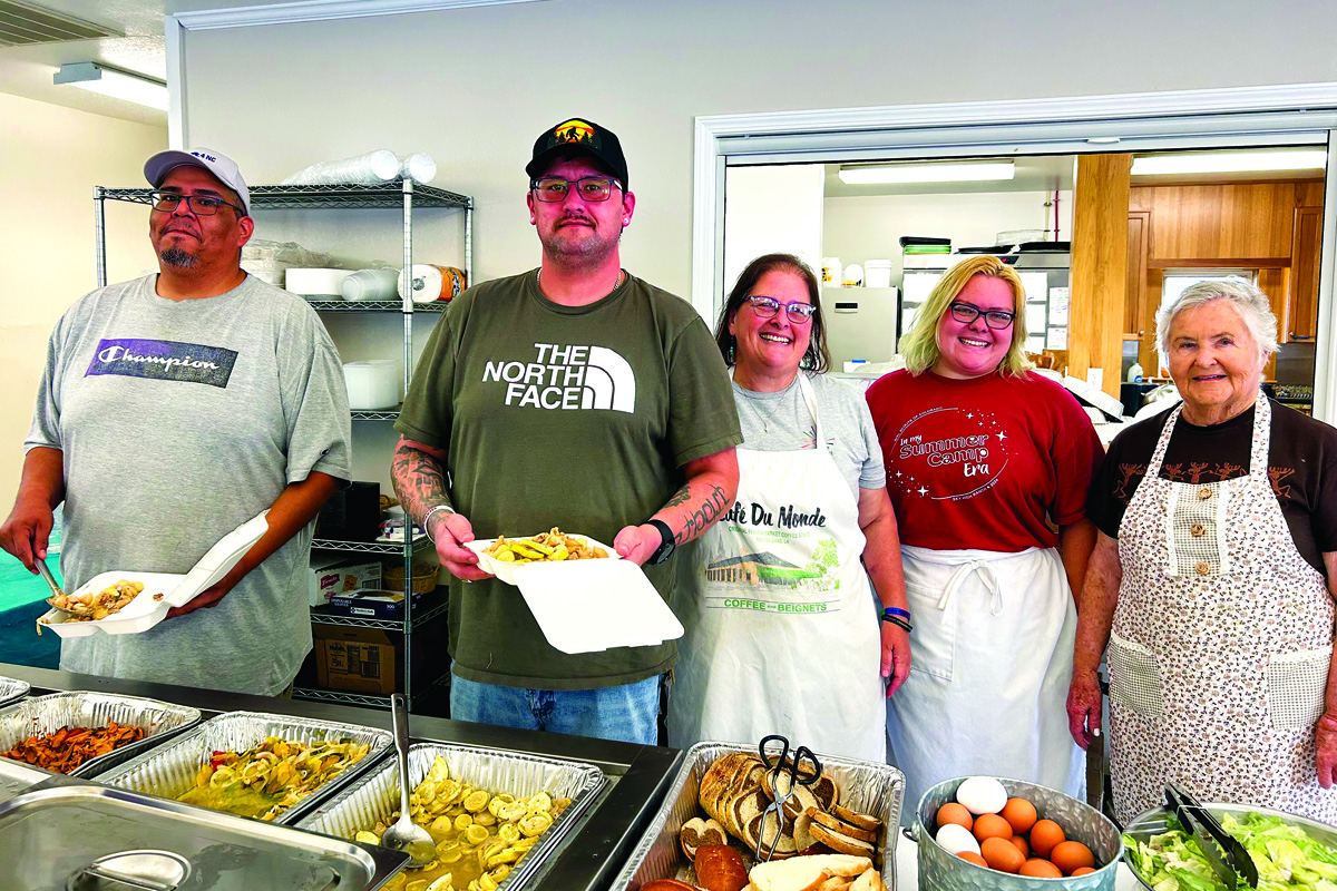 (From left) Brant Grant, Jesse Young, Denise Teague, Amanda Teague and Jeana Brown serve meals at Clyde United Methodist Church. 