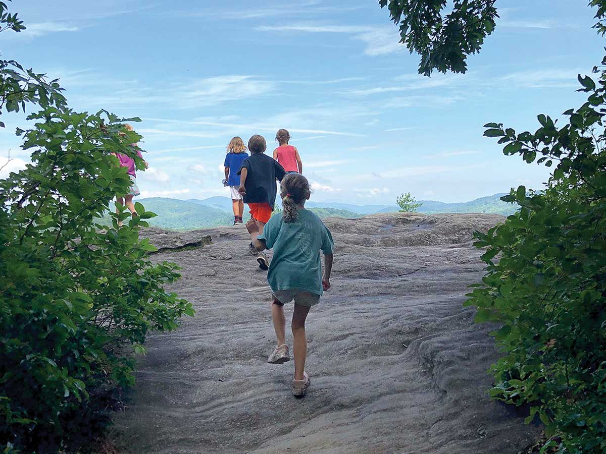 Campers climb to a view during a Highlands Biological Foundation program. HBF photo