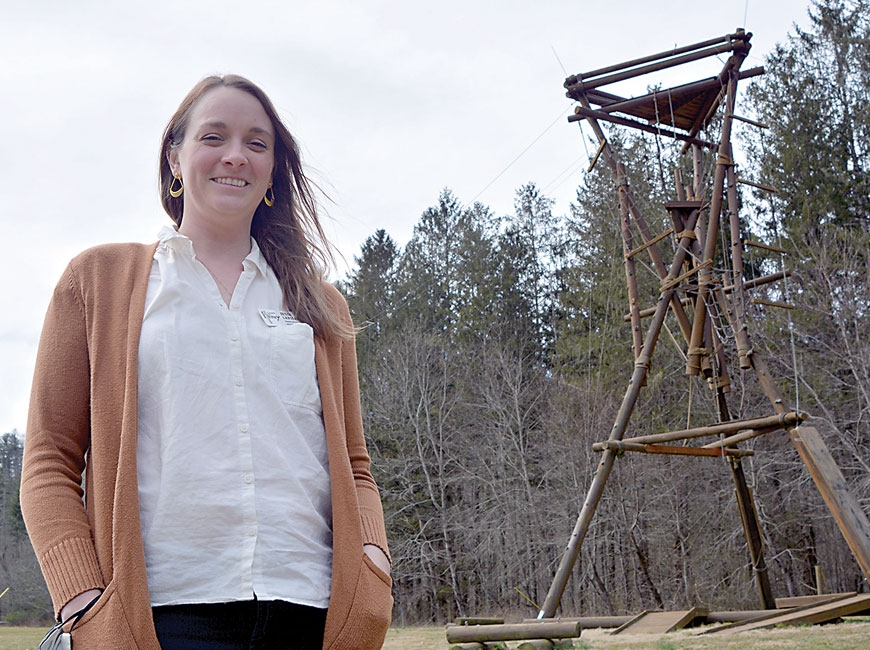Jessi LeFiles, executive director of Camp Henry, stands before the camp’s Alpine tower. Cory Vaillancourt photo