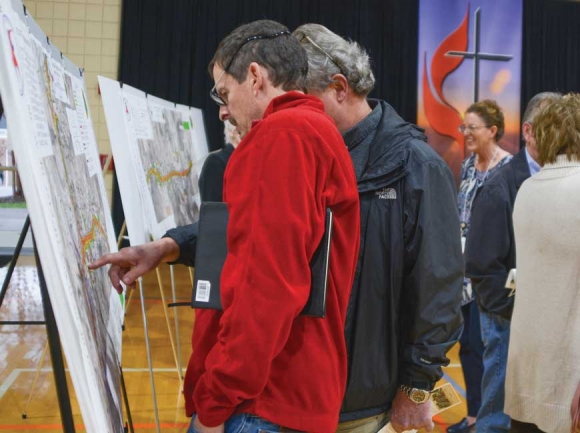Members of the public look over updated maps at a right-of-way drop-in meeting the N.C. Department of Transportation held Dec. 9 in Sylva. Holly Kays photo