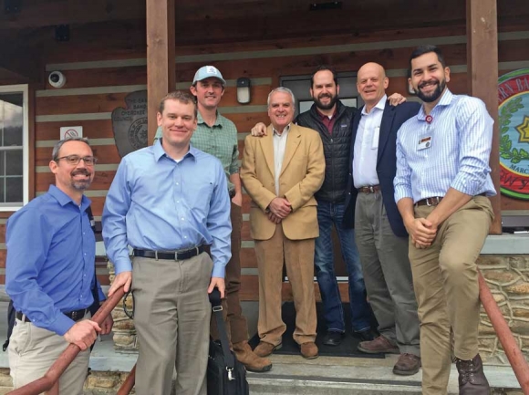 The team of nonprofit and government partners behind the conservation project celebrates Tribal Council’s approval of funding outside the council house Feb. 7. The team includes (from left) Mainspring Deputy Director Ben Laseter, Mainspring Land Conservation Manager Jordan Smith, the tribe’s supervisory biologist Mike Lavoie, Pinnacle Park Foundation Chairman J.K. Coward, EBCI Secretary of Operations Jeremy Hyatt, The Conservation Fund N.C. Director Bill Holman and EBCI Secretary of Agriculture and Natural Resources Joey Owle. Holly Kays photo 