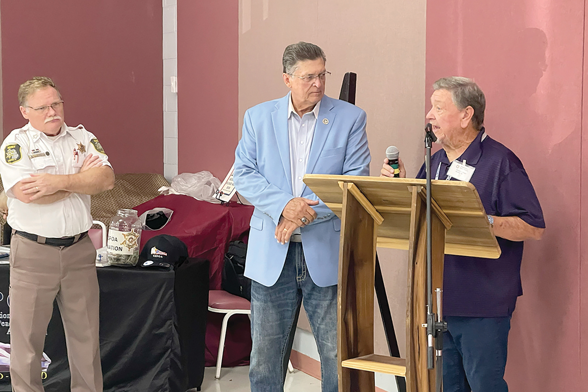 Founder of the Constitutional Sheriffs and Peace Officers Association Richard Mack (left) looks on as Ronald J. Wright  speaks at an event in Murphy earlier this year. 