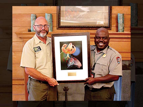Robert Burton (left) displays his winning photo alongside Smokies Superintendent Cassius Cash. NPS photo