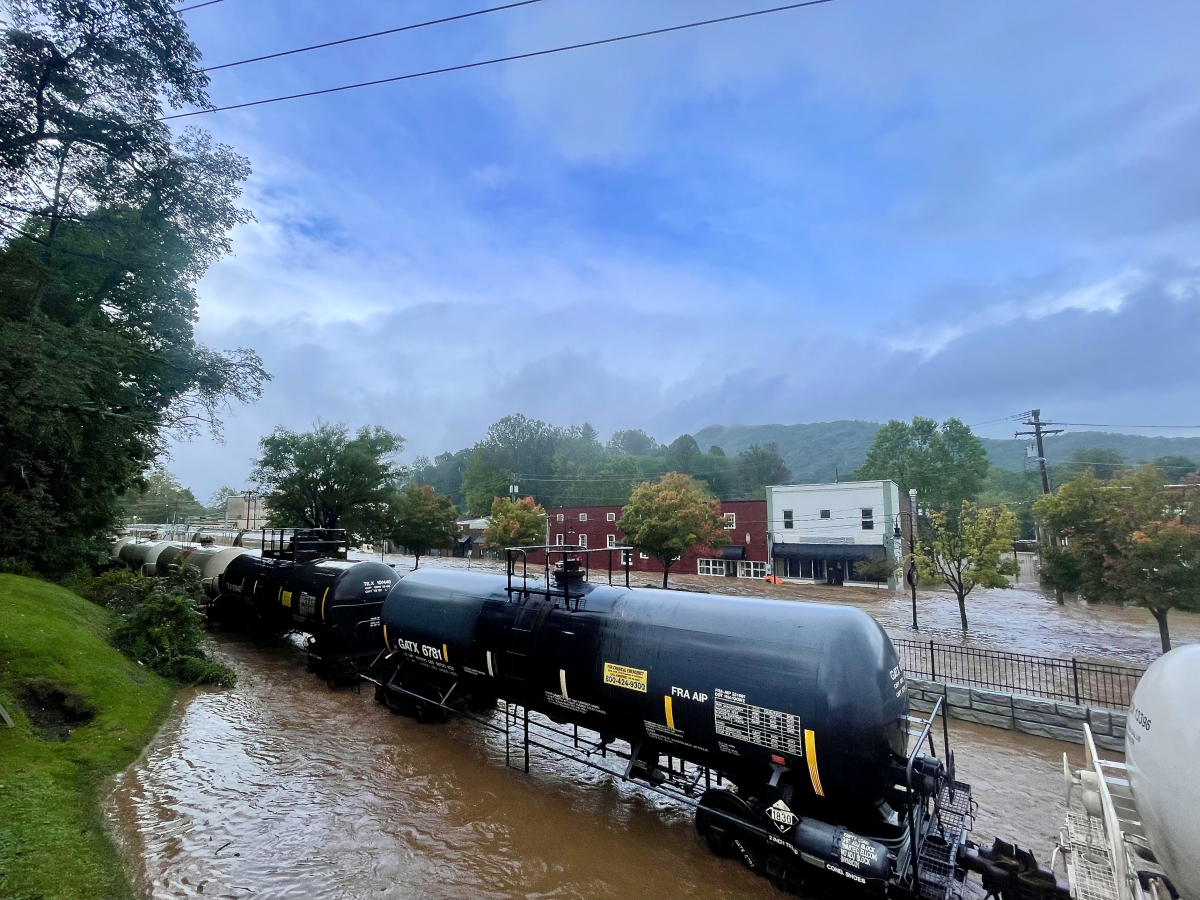 Floodwaters flow through Waynesville&#039;s Frog Level district, damaging a number of small businesses on Sept. 27.