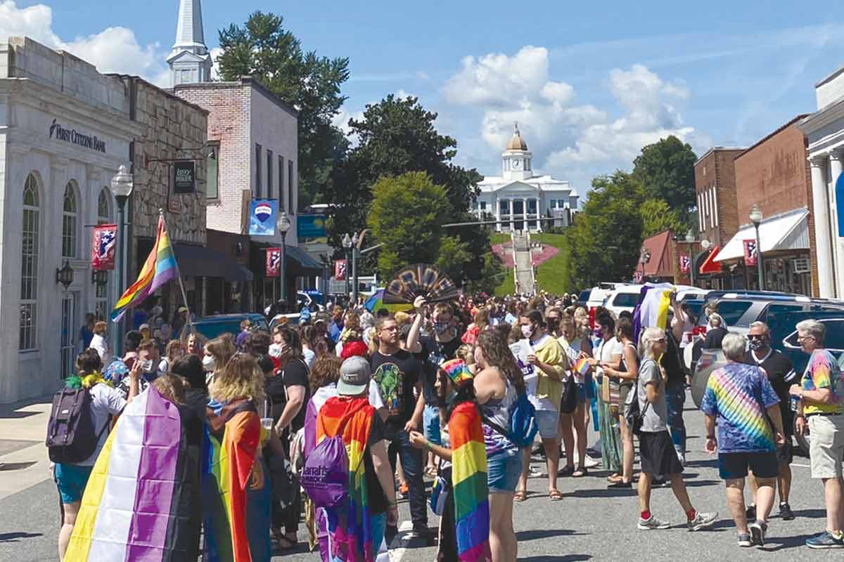 Pride Parade participants march down Main Street during the inaugural Sylva Pride Parade.