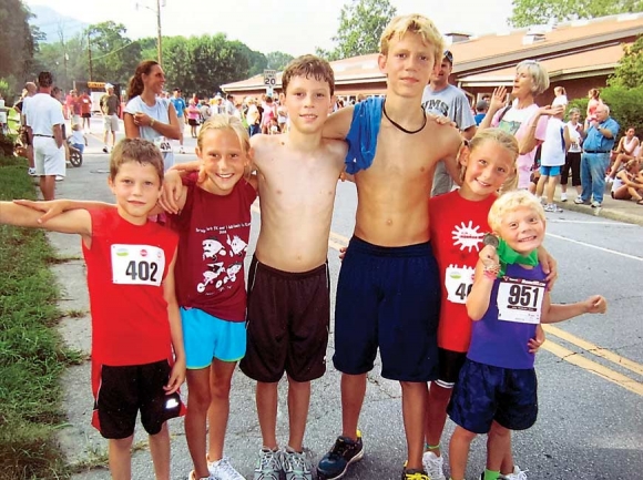 A cluster of young runners hangs out near the finish line, including Riley Howell and three of his siblings. Pictured, from left, are Davis King, Iris Howell, Logan King, Riley Howell, Juliet Howell and Teddy Howell. Donated photo