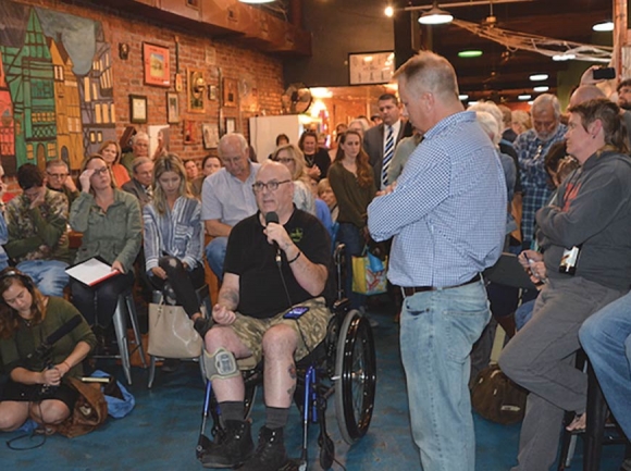 Clark Williams, owner of Frog Level Brewing, asks a question during a public forum held at the brewery to discuss the growing homelessness issue in Haywood County. Jessi Stone photo