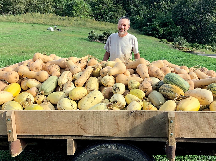 Don Carringer poses with the winter squash harvest he brought in at Carringer Farms in Macon County. ASAP photo