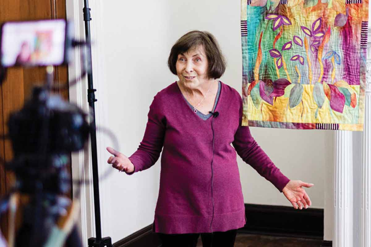 Norma Bradley of Asheville and her quilt that celebrates the life of a friend. (Quilt Alliance photo)
