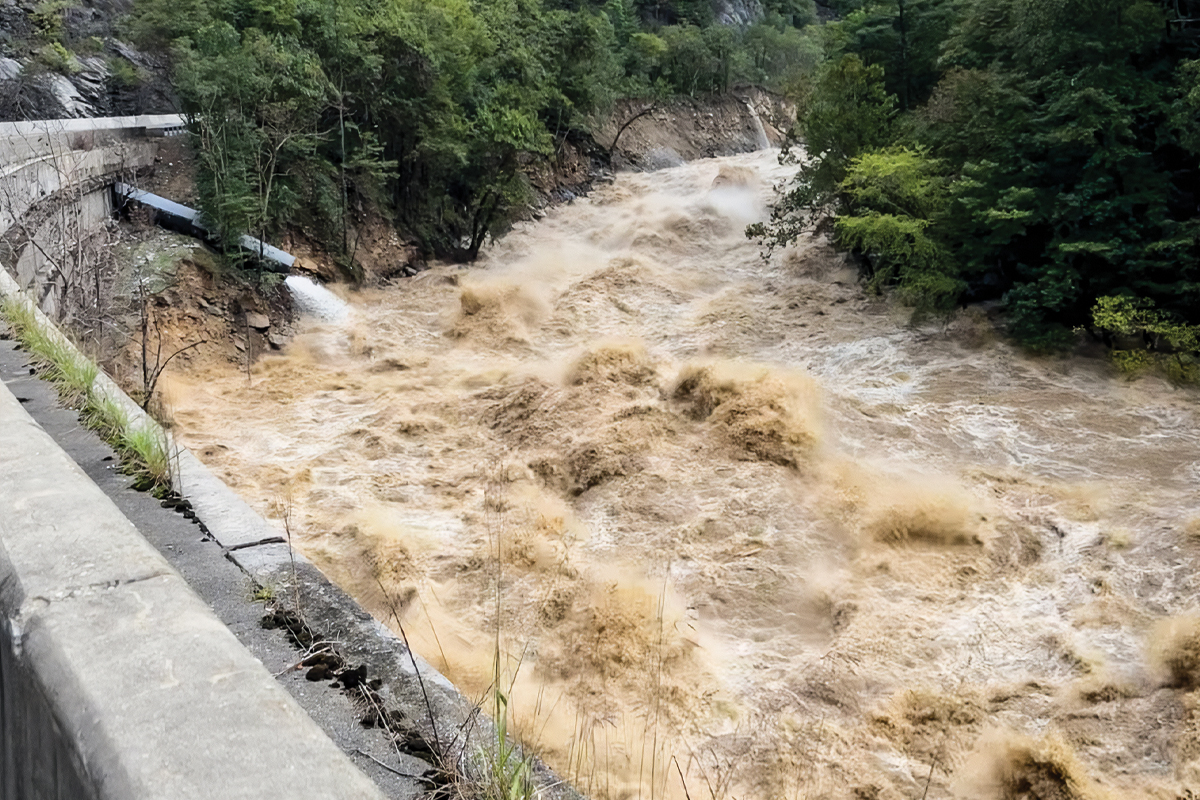 A still-raging Pigeon River flows past I-40 in the aftermath of Hurricane Helene. 