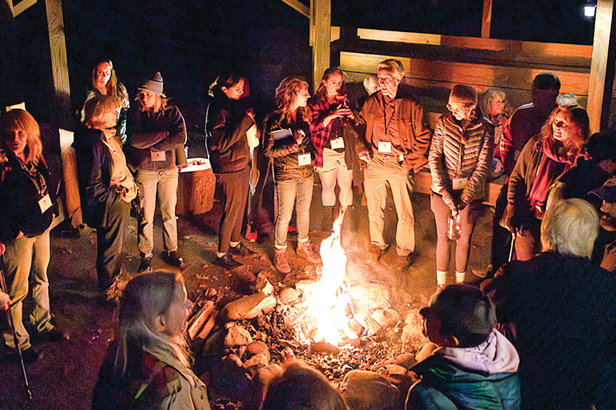 During the evenings, Tremont Writers Conference participants convene to enjoy discussion and fellowship. The first night of last year’s event found the group in the council house around an inviting fire. Michele Sons photo.