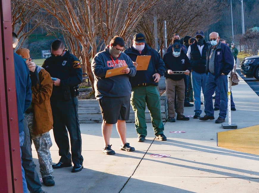 First responders line up outside the Cullowhee Recreation Center Jan. 15 to receive their first COVID-19 vaccination shot. Holly Kays photo 