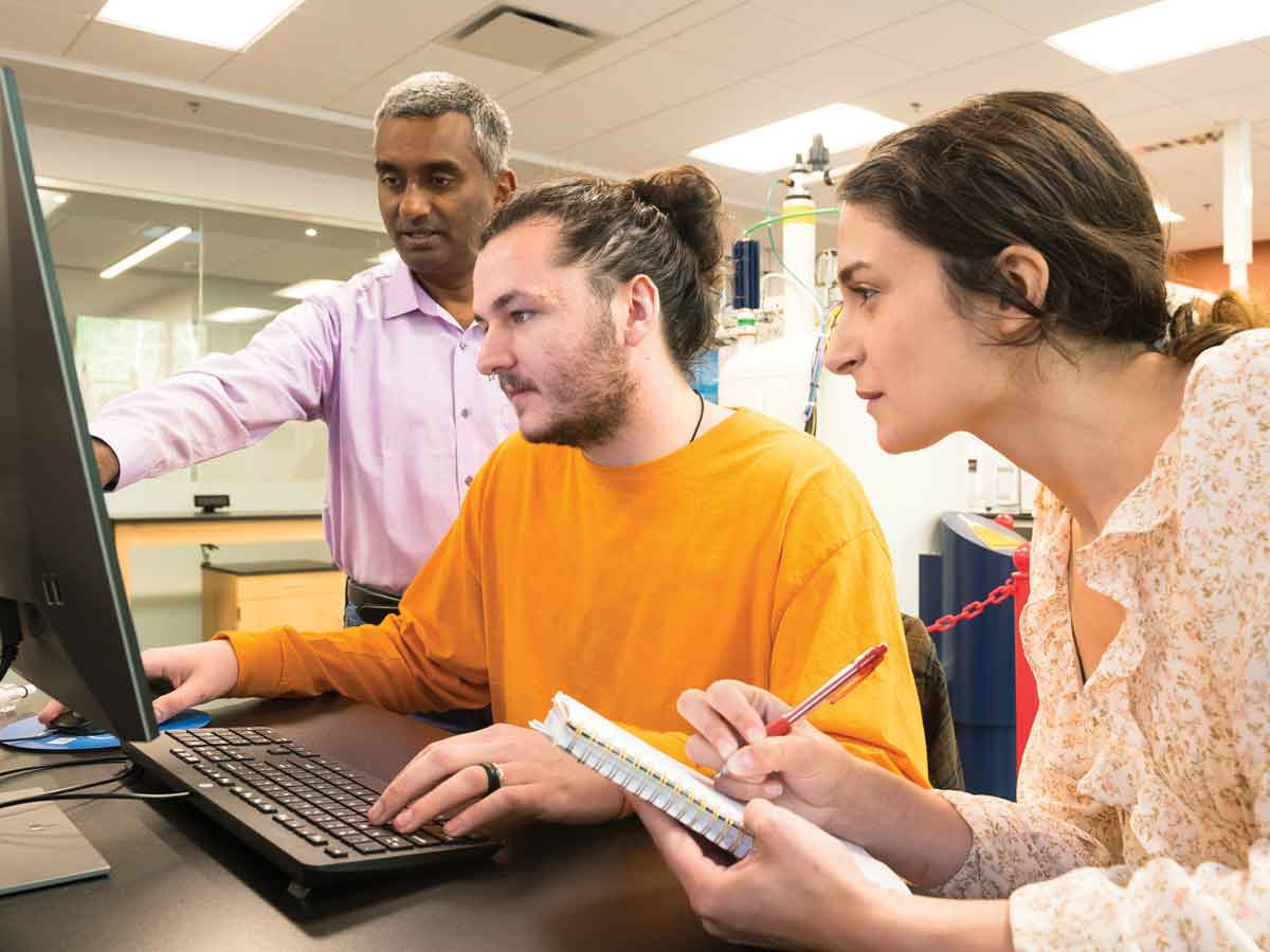 Associate professor Channa De Silva (left), Brandon Sanders and Caleigh Gress Byrd work together in a lab in the new Apodaca Science Building. WCU photo