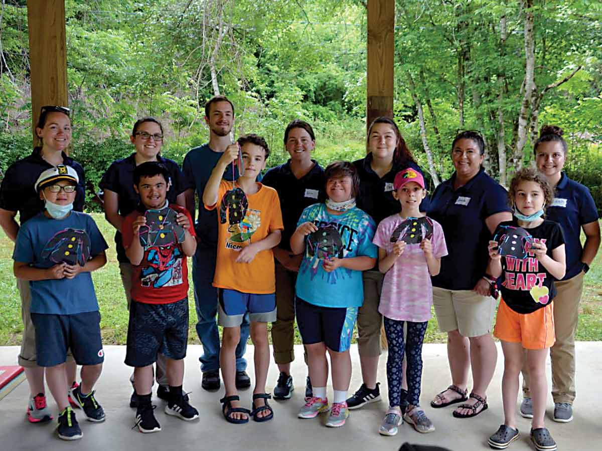 Students with the participants of the Full Spectrum Farms kid’s camp are, back row from left: Kristen Sawyer, Elisabeth Trantham, Western Carolina University student Pierce Muth, Erin Hyde, Haley Hamrick, Amanda Canzone, Leah Cody and Ashley Mull.