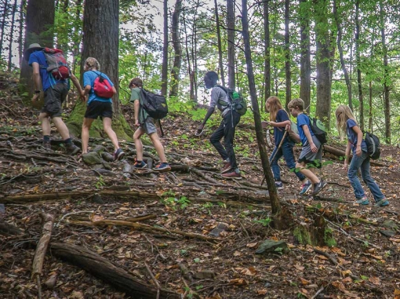 A group of Tennessee fifth-graders walks through the woods. David Bryant photo