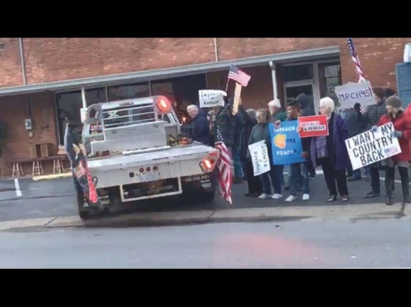 A counter-protester pulls his pickup truck into a rally held in Sylva Dec. 17 calling for President Donald Trump’s impeachment. Isabel Couture photo