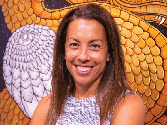 Shana Bushyhead Condill, the Museum of the Cherokee Indian’s new director, stands before a painting by Eastern Band of Cherokee Indians member Joshua Adams displayed in the museum’s contemporary art exhibit. Holly Kays photo