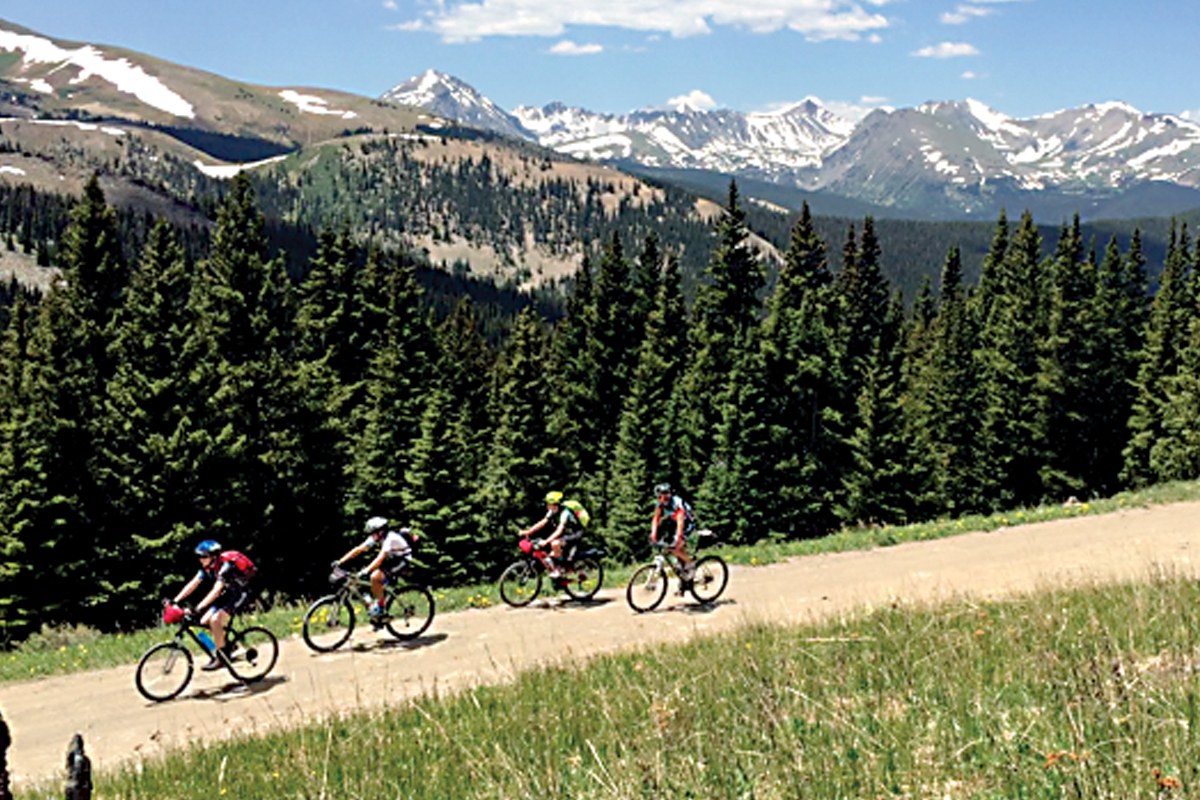 Summertime snowfields shine on the Rockies as Project Discovery students make a long climb during a 2016 trip to Colorado. WCU photo