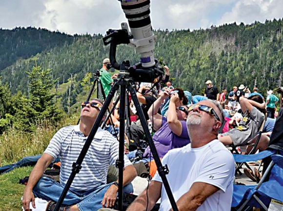 Visitors peer into the sky during the solar eclipse event at Clingmans Dome Aug. 21. NPS photo