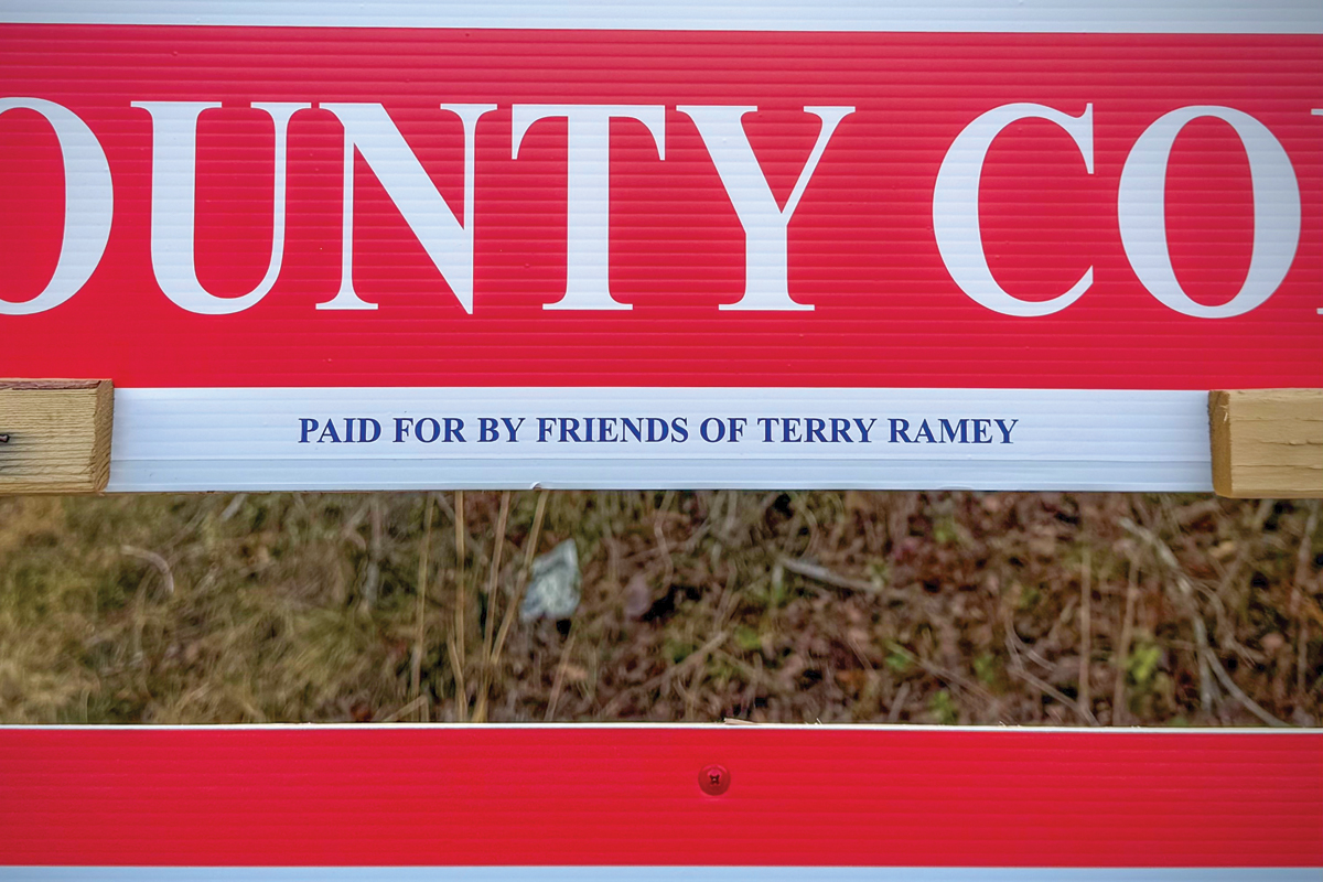 A campaign sign for Haywood County Commissioner Terry Ramey on Russ Avenue contains a reference to who paid for it. 