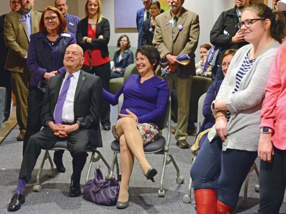 David and Susan Belcher (seated) watch the live broadcast launching Lead the Way in the A.K. Hinds University Center, surrounded by members of the Catamount Nation. Holly Kays photo