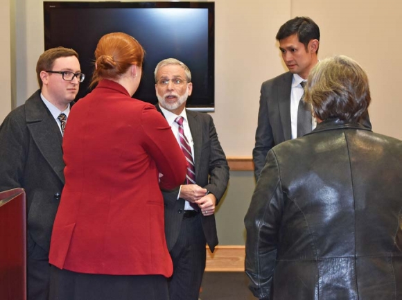 Attorneys (left to right) Adam Melrose, Martha Bradley, Mark Melrose and Jonathan Song speak with Waynesville Development Services Director Elizabeth Teague at a meeting Jan. 24. Cory Vaillancourt photo