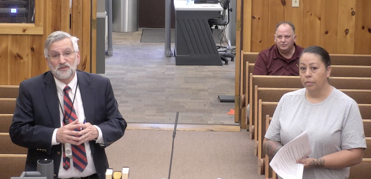 Attorney General Mike McConnell (left) addresses Tribal Council as Police Chief Carla Neadea and Cherokee One Feather Editor Robert Jumper look on.