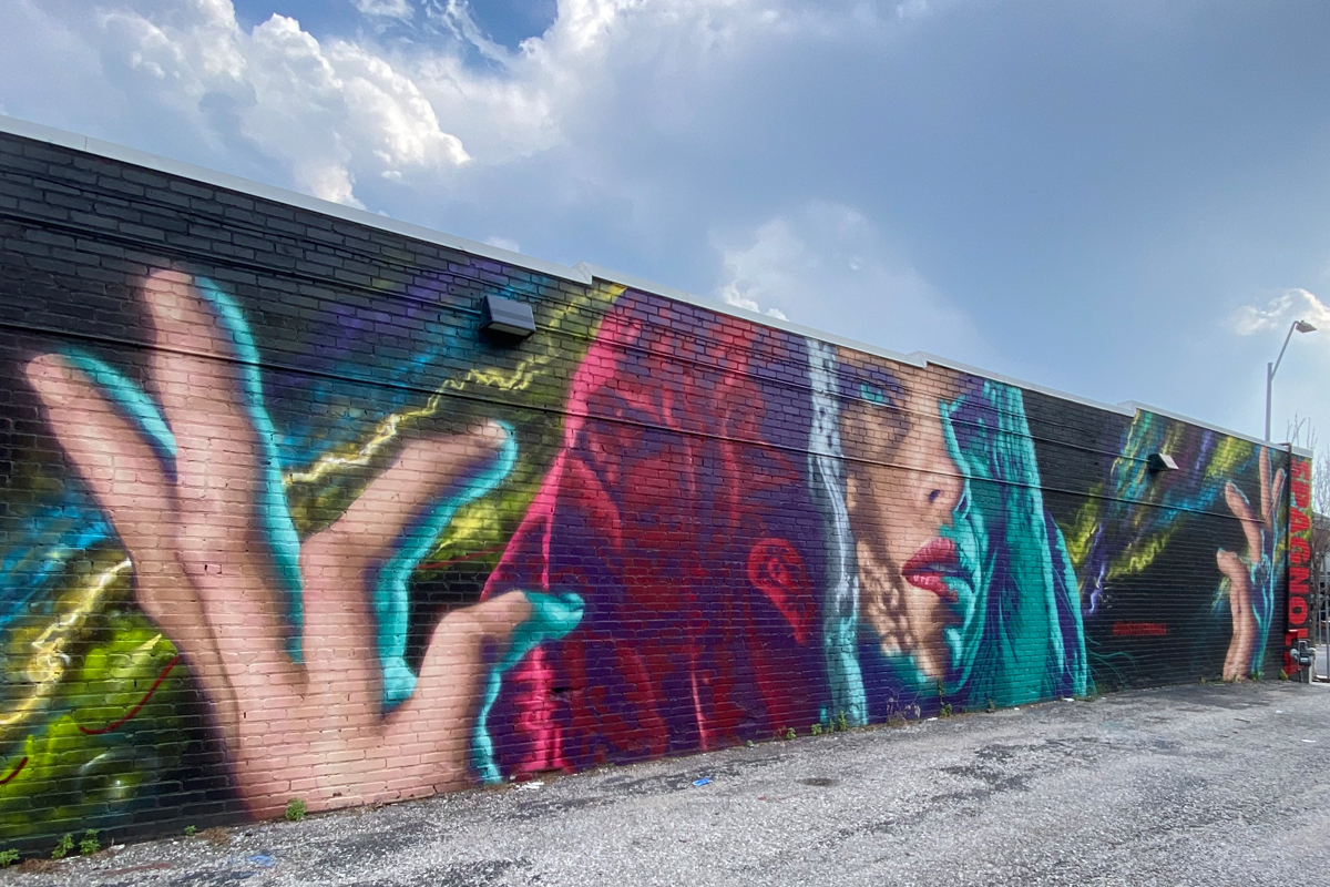 A renowned tattoo artist and muralist, works by Dustin Spagnola can be found around the city of Asheville (mural pictured is in Kansas City) and other metropolitan areas across the country. Breanna Delannoy photos