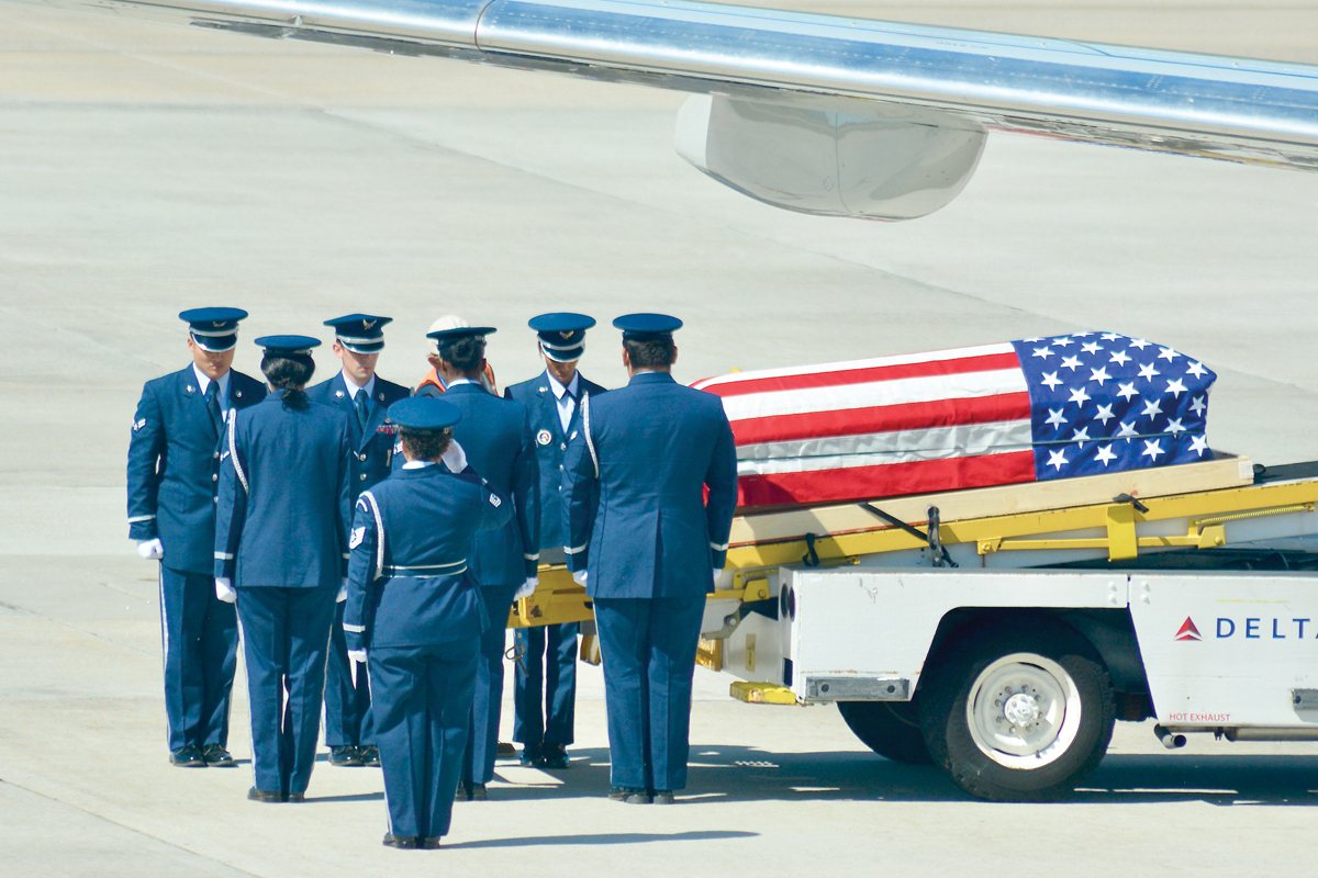 A detachment from Shaw Air Force Base prepares to escort Capt. Fred Hall’s remains to a waiting hearse.  Cory Vaillancourt photo