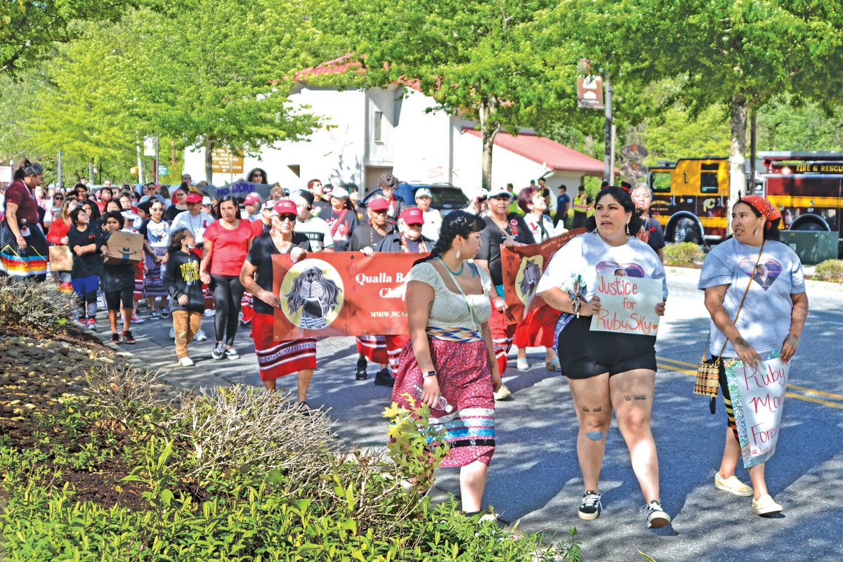 Tribal members march down Tsali Blvd. in Cherokee in honor of the National Day of Awareness for Missing and Murdered Indigenous Women. Holly Kays photo