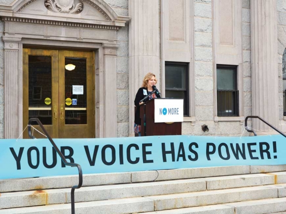 Haywood County Domestic Violence Task Force Member Buffy Queen addresses a rally April 25 outside the Haywood County Historic Courthouse. Cory Vaillancourt photo