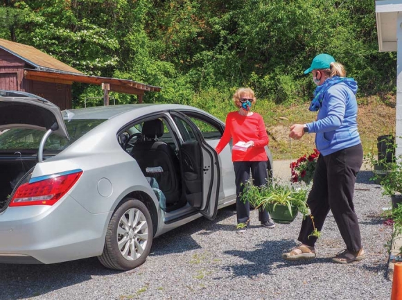 Melissa Tinsley assists with curbside pickup during the annual plant sale. Lake Junaluska photo