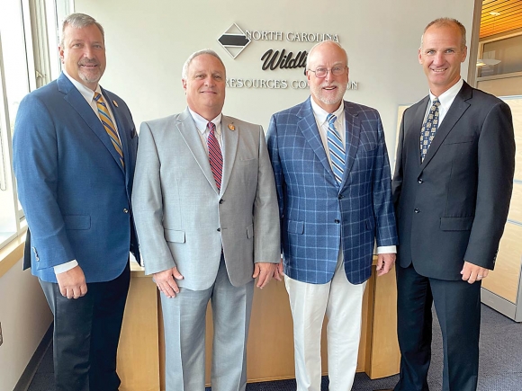 Outgoing Chairman David W. Hoyle Jr (left) stands with (from left) new Chairman Monty R. Crump, new Vice Chairman Thomas L. Fonville and Wildlife Resources Commission Executive Director Cameron Ingram. NCWRC photo