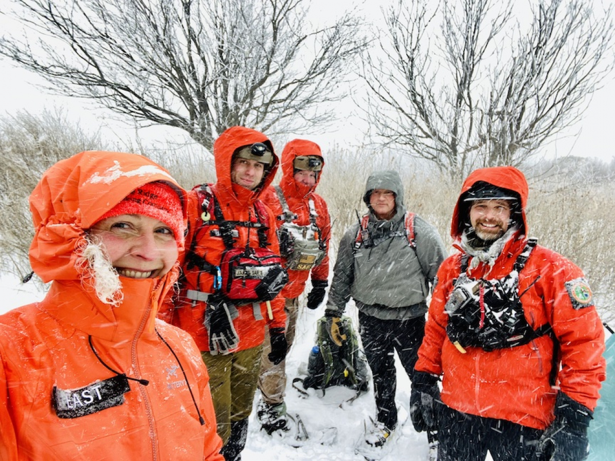 Rescuers Nancy East, Kyle James, Graham Ebaugh, David Blackburn and Eric Sollie pause for a photo in the snowstorm. Rescuer David Walker is not pictured. Donated photo