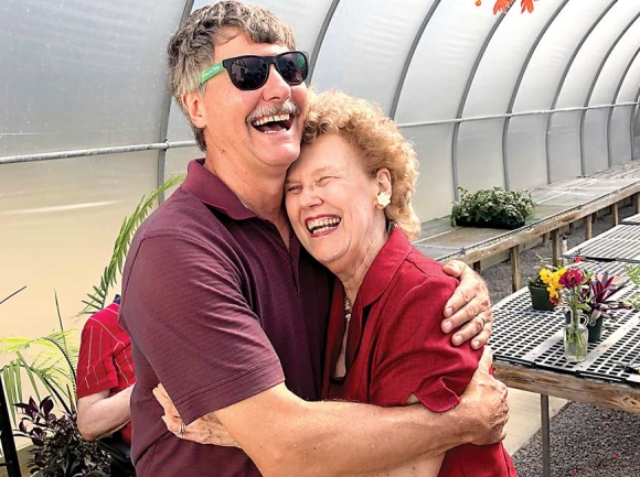 Dale Stanton-Hoyle and his mother, Barbara Stanton, share a joyous embrace upon entering the newly renovated greenhouse. Bill Graham photo