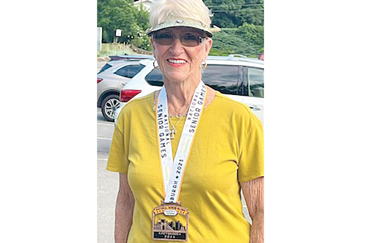 Betty Henderson displays her bronze medal. Donated photo 