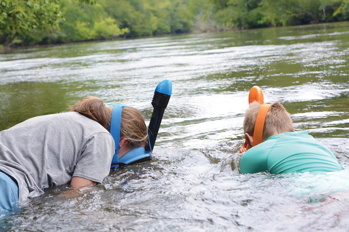 Maury Wahtera, of Franklin, snorkels with her son Henry, 8, during an event Aug. 2. Holly Kays photo