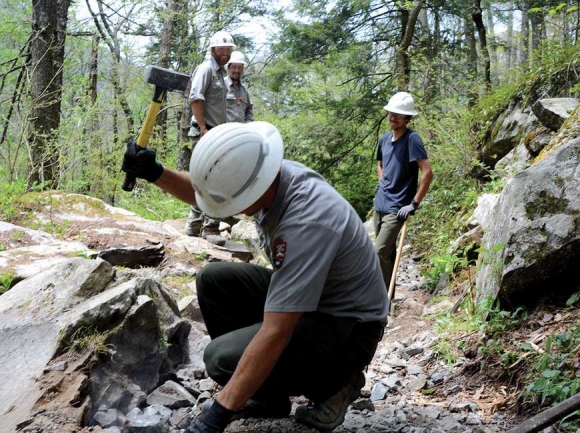 Trail crews work on the trail as it passes by Rainbow Falls. Holly Kays photo