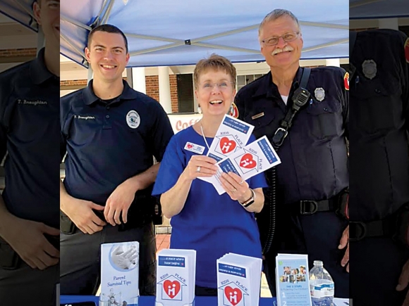 Highlands Police Officer Tim Broughton, (from left) KIDS Place Executive Director Alisa Ashe, and Franklin Fireman Greg pictures at Safety Day in Downtown Franklin. Donated photo