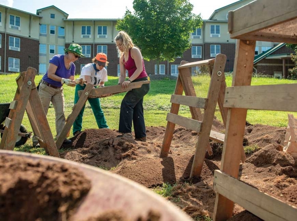 Participants in WCU’s summer archeology field school work on the Norton Field site. WCU photo