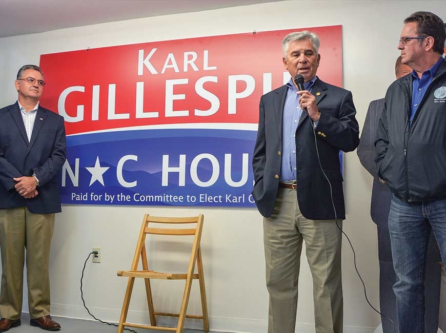 Macon County Commissioner Karl Gillespie (left) looks on as former Macon commissioners Jim Davis and Kevin Corbin (right) introduce him. Cory Vaillancourt photo