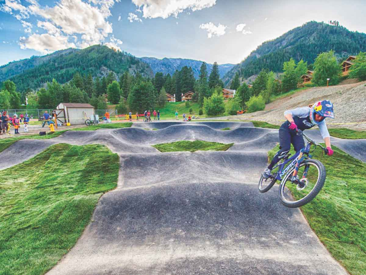 A rendering shows a mountain biker navigating an asphalt pump track similar to the one planned for Cherokee. Donated image