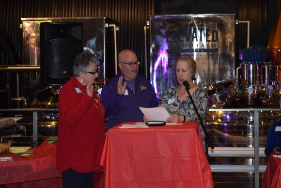 Chamber President Patty Carter swears in new board members Dave Angel and Rose Beck.