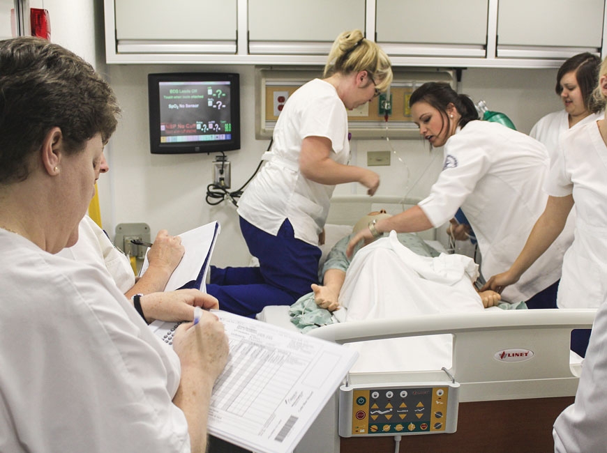 Haywood Community College students work with a simulation lab ‘patient.&#039; HCC photo