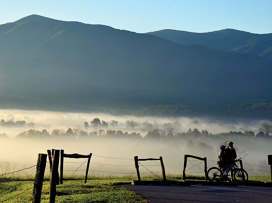 Cyclists take a break during a ride on Cades Cove Loop Road. NPS photo