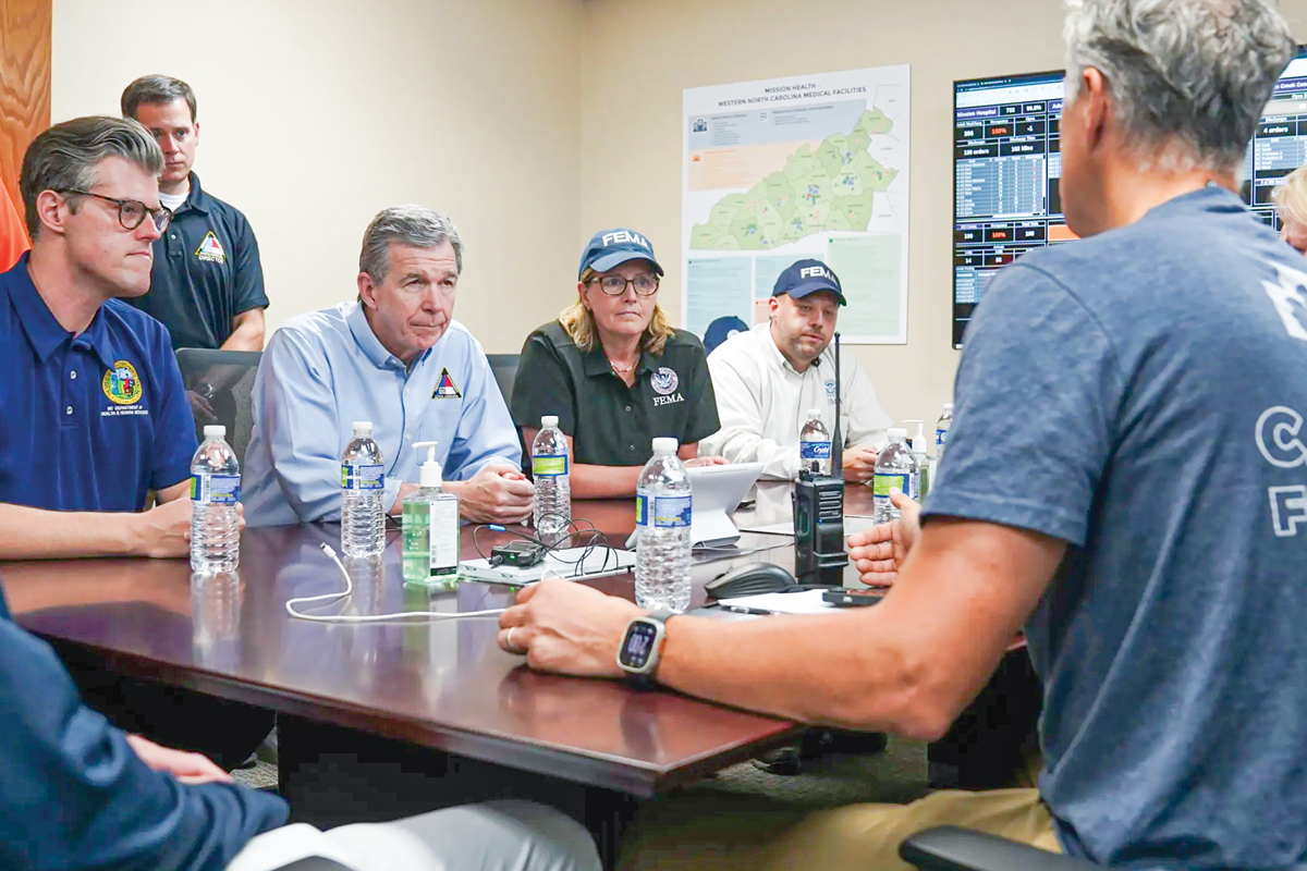 State and federal officials talk with Mission Hospital executives about Helene’s impact on the hospital and Asheville. Paul Barker/NC Governor’s office photo