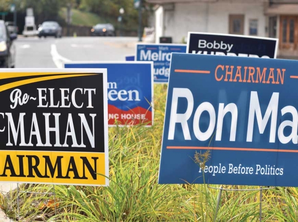 Election signs crowd a grassy area in downtown Sylva the week before the election. Holly Kays photo