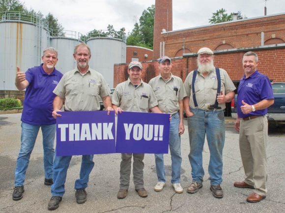Steam plant crew members and Western Carolina University’s associate vice chancellor of facilities management Joe Walker show their thanks that funding to replace WCU’s aging steam plant was included in the state legislature’s budget proposal. WCU photo