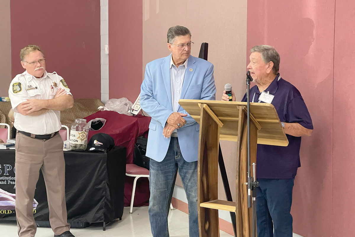 Dar Leaf, left, and Richard Mack, center, prepare to speak.  Kyle Perrotti photo